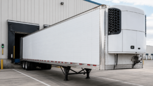 Refrigerated semi trailer at a cold dock for reefer trucking and temperature-controlled freight.