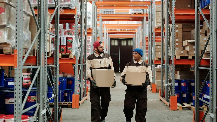 FBA prep warehouse in California with workers handling boxes and fulfillment inventory
